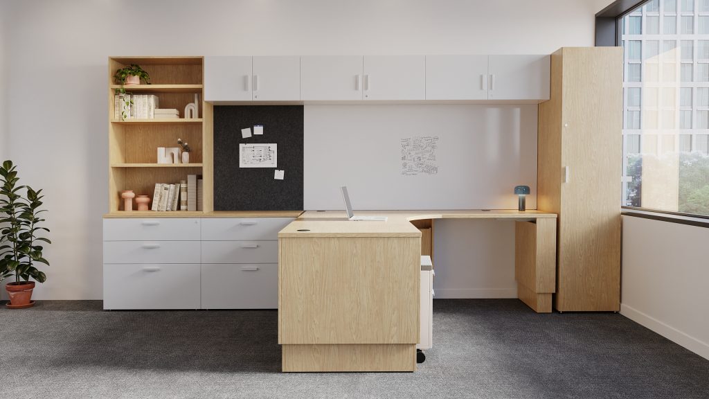 Enclosed height-adjustable desk with a small PET tackboard, whiteboard, and shelving above. With wardrobe and credenza storage.